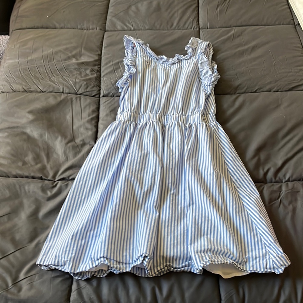 This is a pretty dress with blue and white stripes.